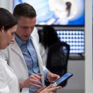 Healthcare workers looking at tablet