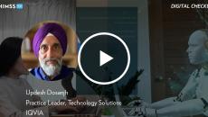 Updesh Dosanjh at IQVIA_ Person typing with animated chatbot AI by sakdam/Vetta/Getty Images
